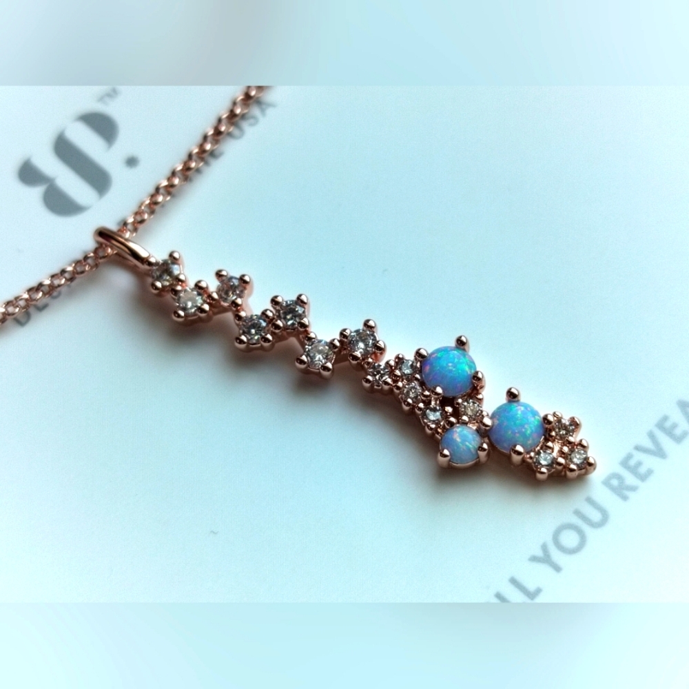 She runs the show bomb party OG Necklace light blue fire opal rose gold plating
